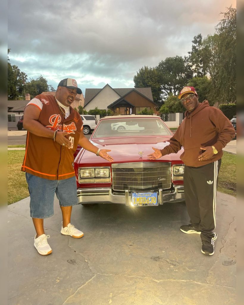 Happy customers picking up their freshly detailed classic car near Studio City