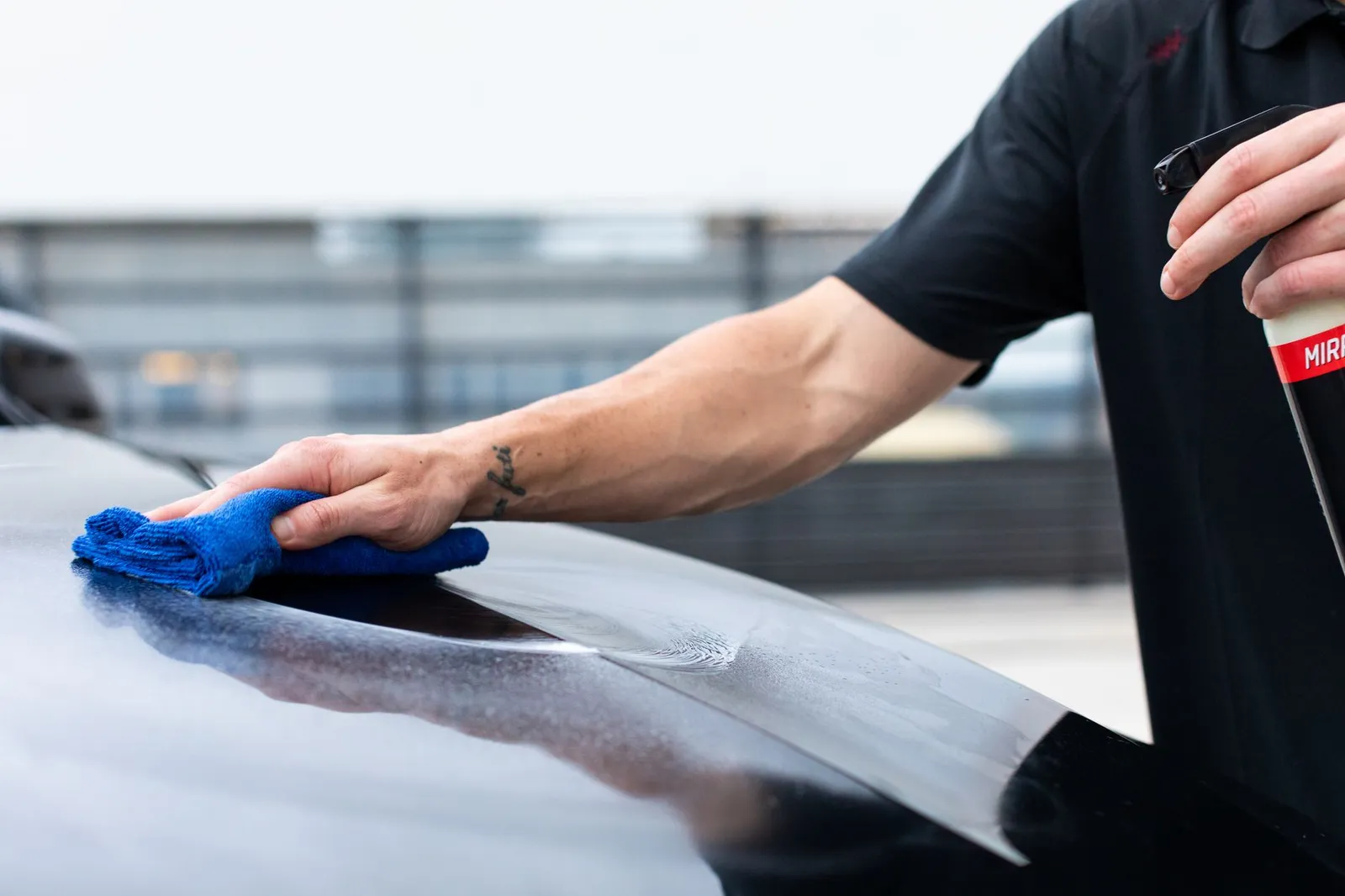 Applying ceramic coating protection to a vehicle panel by hand