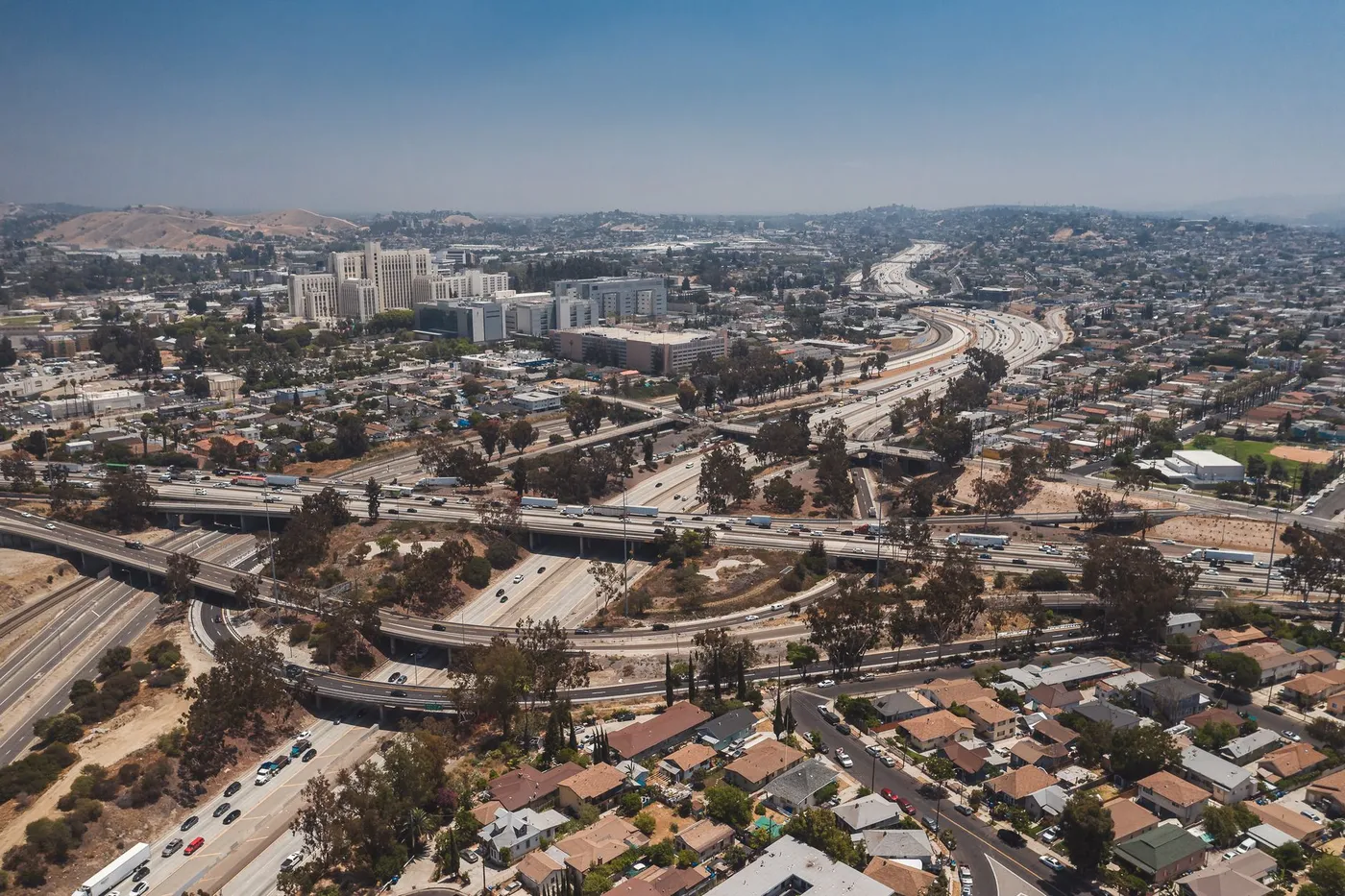 Aerial view of a Los Angeles freeway interchange — the daily commute Sherman Oaks paint endures